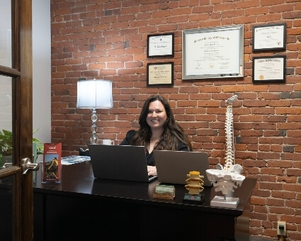 Dr. Tatiana sitting at her office desk