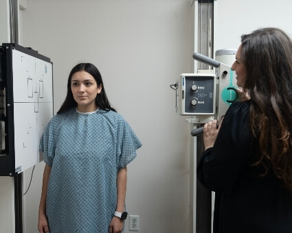 Dr. Tatiana assisting patient with x-rays