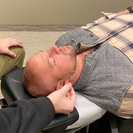 acupuncture in mans ear