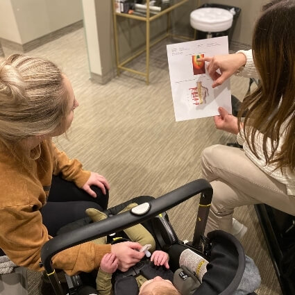 Dr A talking with baby and mom