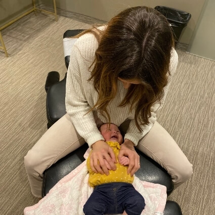 Dr Ashley adjusting baby