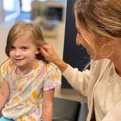 Dr Ashley examining patients ear
