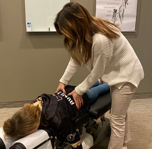 Farmington doctor adjusting pediatric patient at Family Chiropractic Center