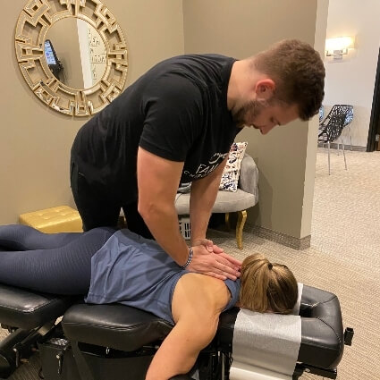 patient having back adjusted