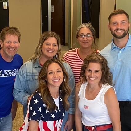 our entire team smiling