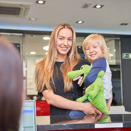 woman-and-toddler-checking-into-dental-office-sq