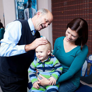 Dr. Thoma adjusting child