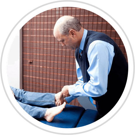 Dr. Thoma adjusting patients foot