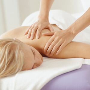 Young, blonde woman having massage