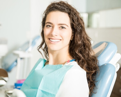 Smiling lady in dental chair