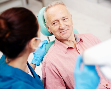 Older male patient in dental consultation