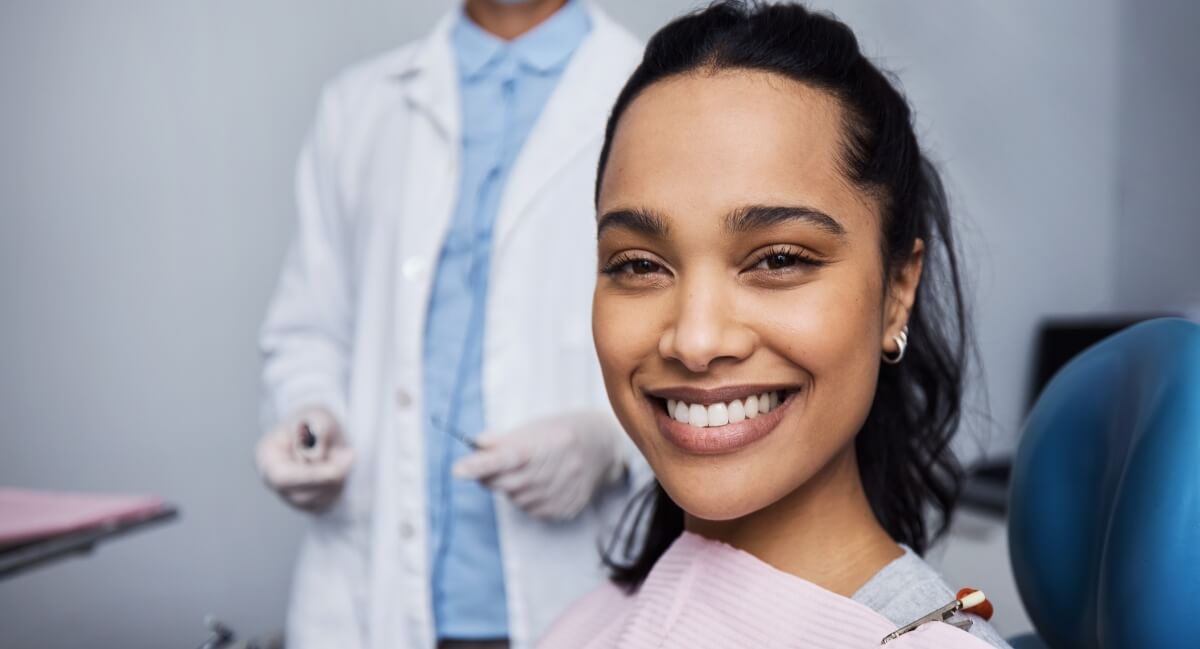 Smiling lady sitting on dental chair