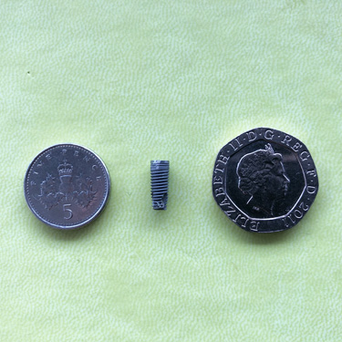 implant size compared to coins