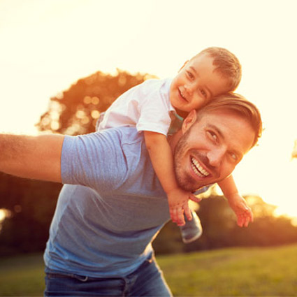 dad with baby on back