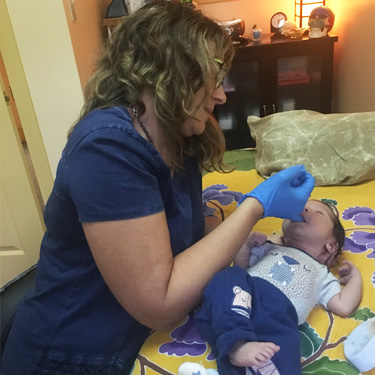 Dr. Tamara treating a baby