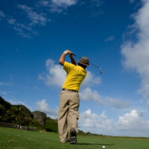 Back of golfer taking a swing