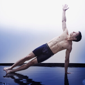 Man in side bridge pose