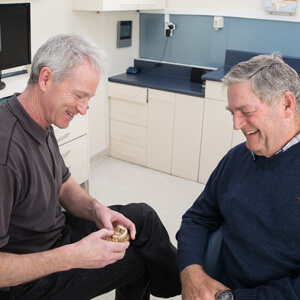 Dr Raymond consulting with patient