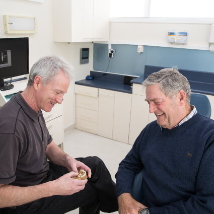 Blockhouse Bay dentist Dr Pete talking with patient