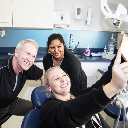 Dr Peter taking selfie with patient