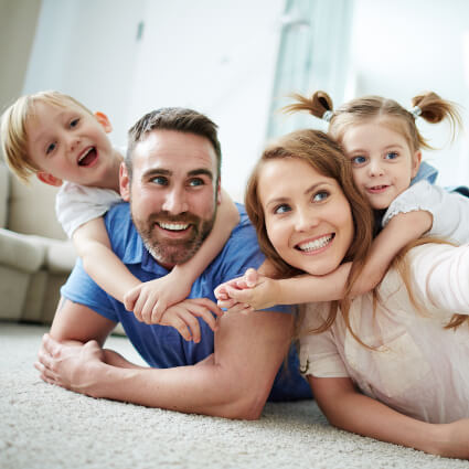 Mom, Dad and kids lying on floor