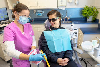 Kim Hygienist working on patient