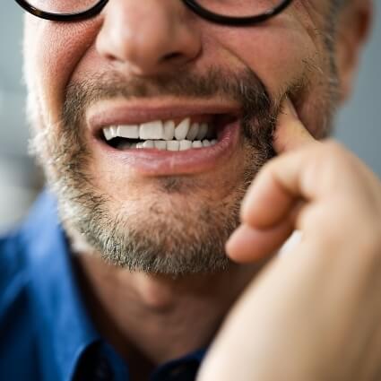 Man with painful tooth