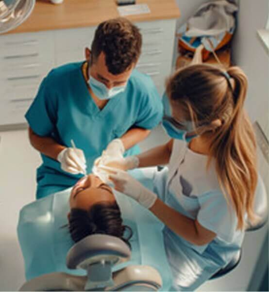 dentists working on patient