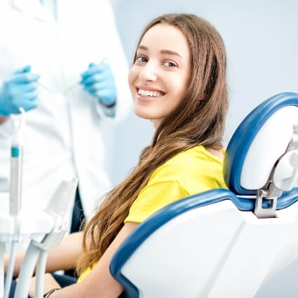 Young female smiling dental patient