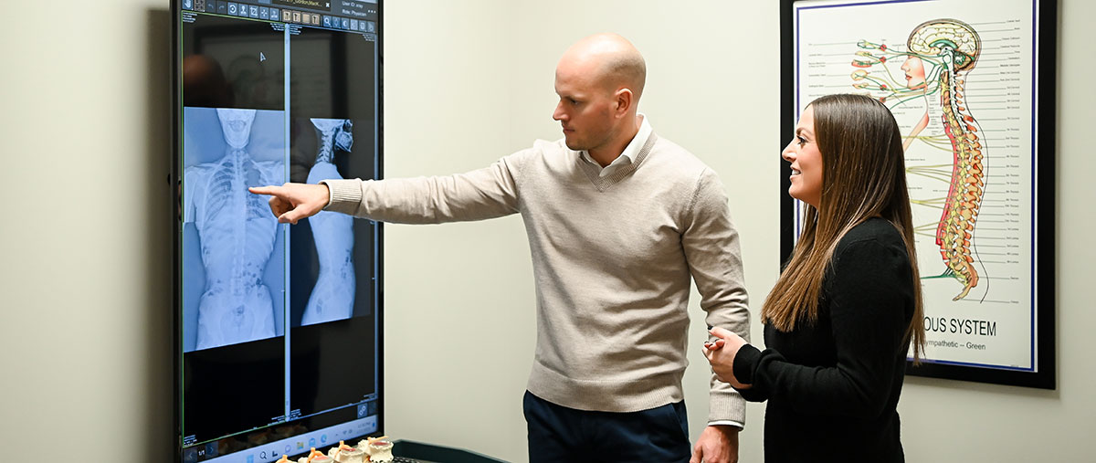 Dr. Andrew pointing at xray