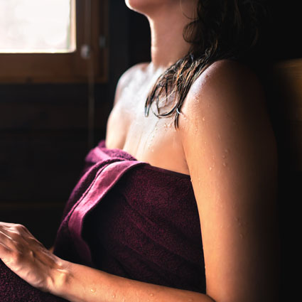 Woman Sweating in Sauna