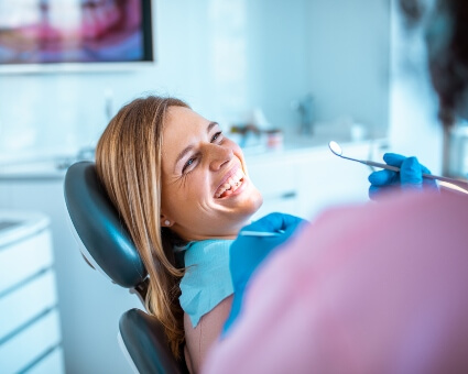 Happy female during dentist appointment