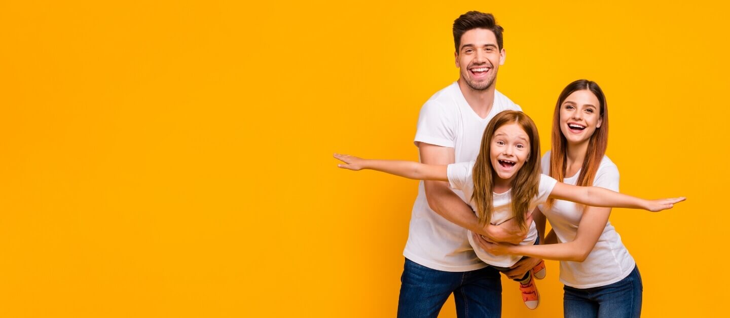 Mom and dad playing with daughter