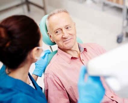 Older male patient in dentist appointment