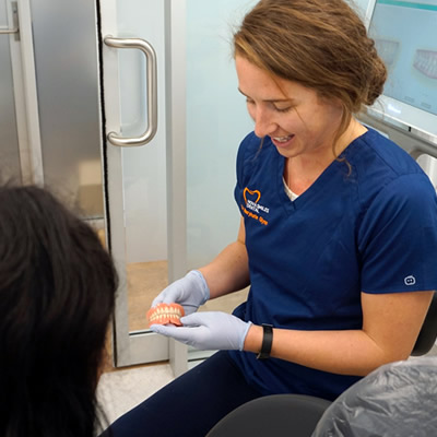 Dr MaryKate showing teeth demo