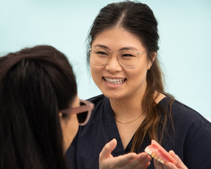 Wallsend dentist Dr. Jenny explaining dentures to patient