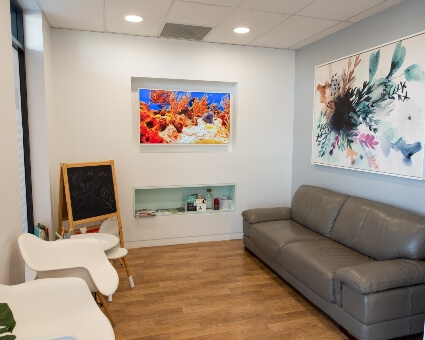 Woman sitting in patient waiting area