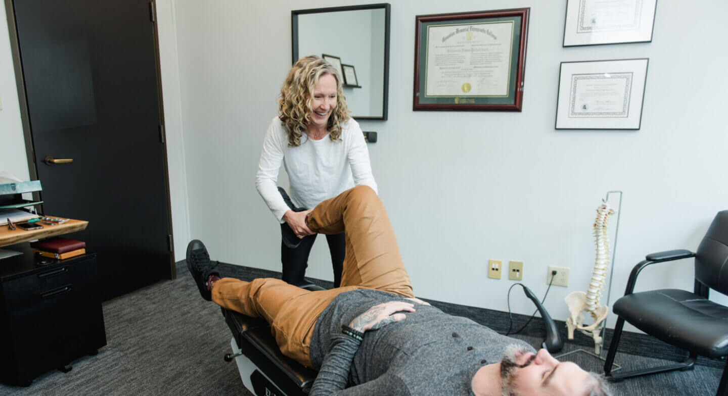 Dr. Catherine adjusting patient