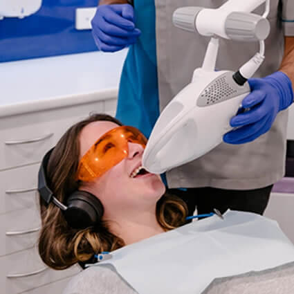 Patient on laser teeth whitening