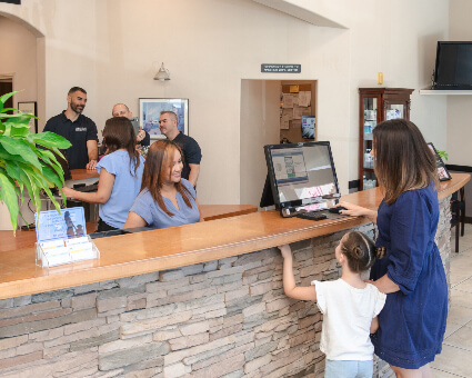 Patients checking in at front desk
