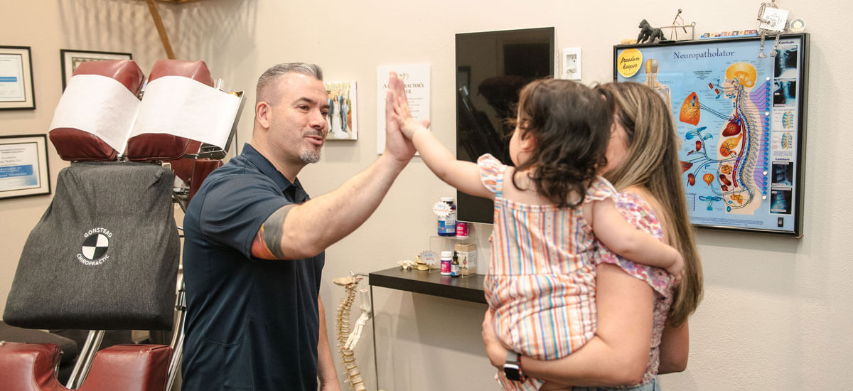 doctor high five young girl
