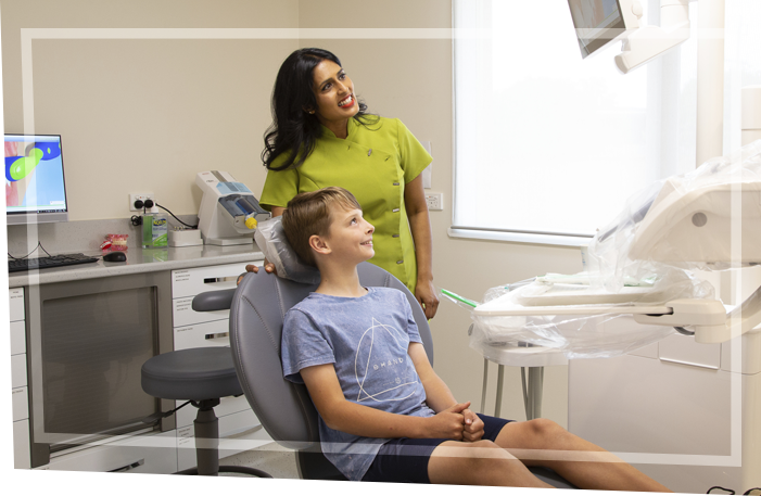 doctor and boy looking at screen