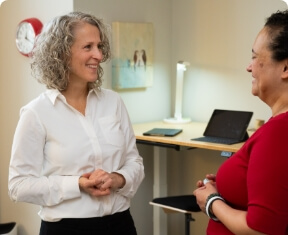Waterloo chiropractor Dr Lisa talking with a patient