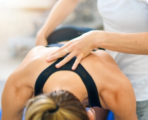 woman having back adjusted