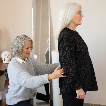 Waterloo chiropractor Dr Lisa checking patients back