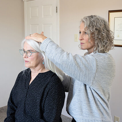 Dr Lisa adjusting patients neck
