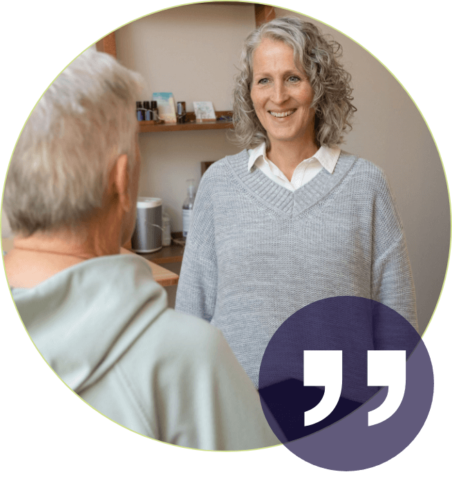 Waterloo chiropractor Dr Lisa smiling and talking with patient