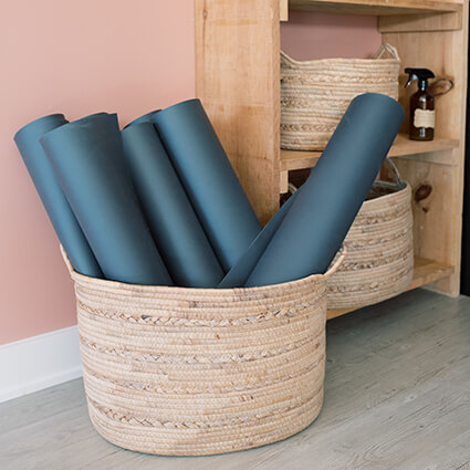 yoga mats in basket