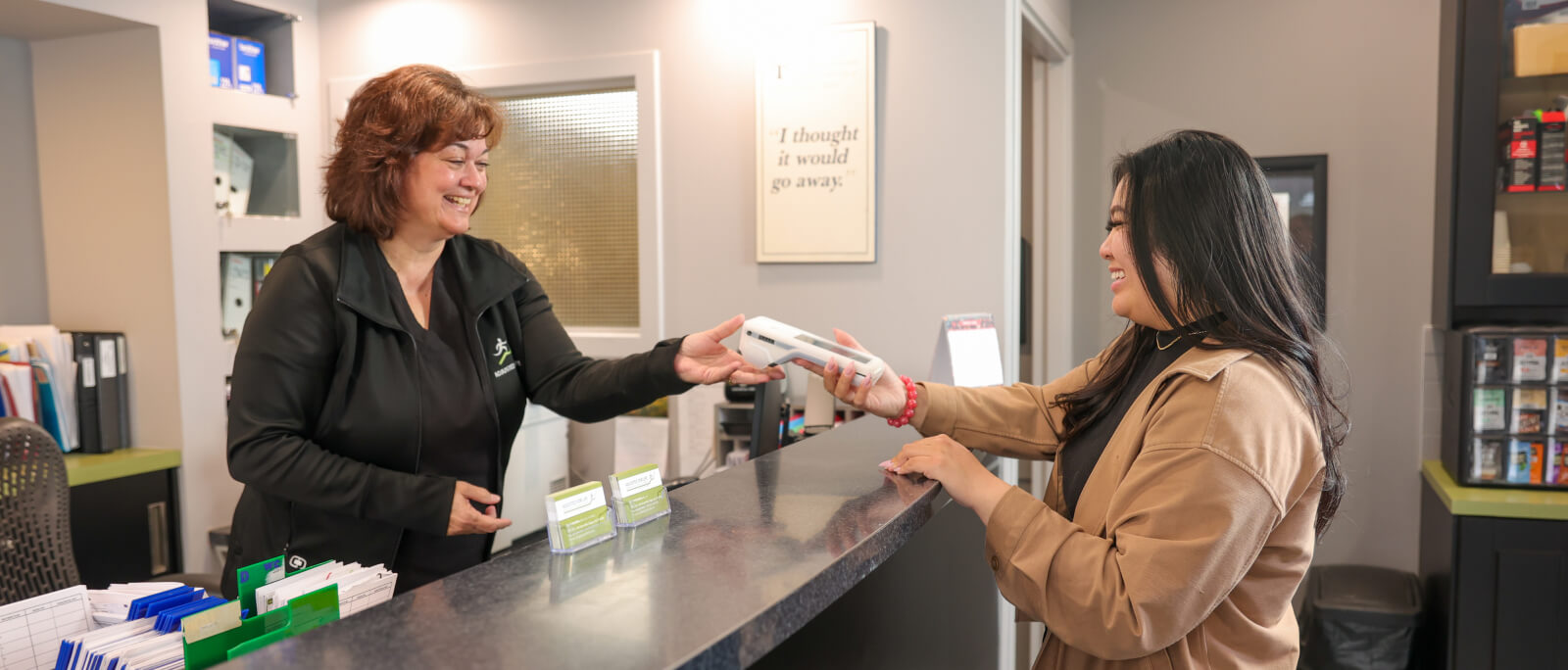 staff giving paperwork