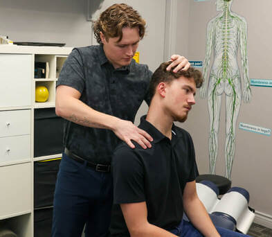 Calgary NW chiropractor Dr. Ford adjusting a patient